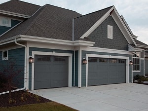 A home with a single and double garage door.